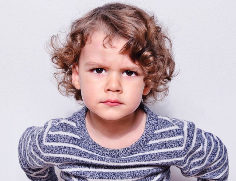 Grumpy_little_boy_with_striped_shirt1-e1624447739694-768x590